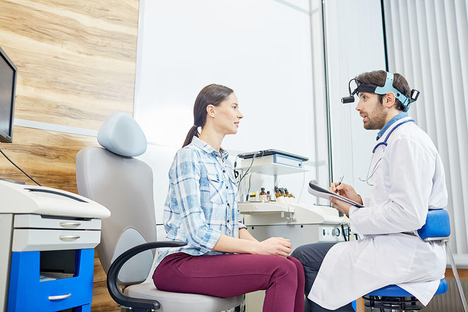 Doctor talking to patient about how smoking affects vision