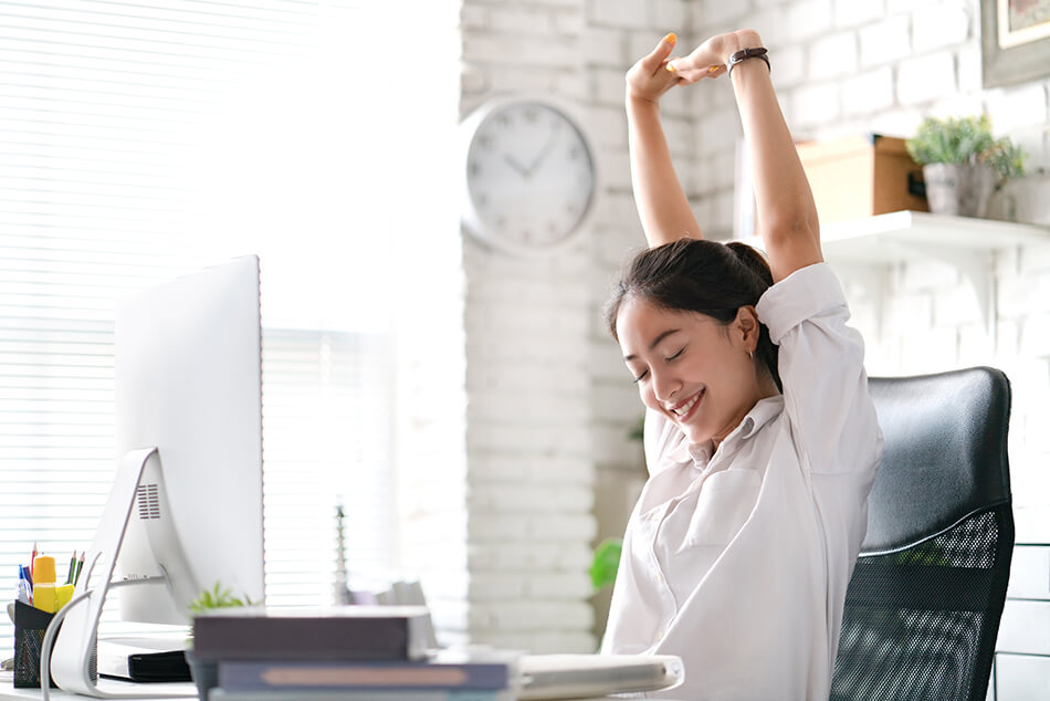 Happy woman at desk