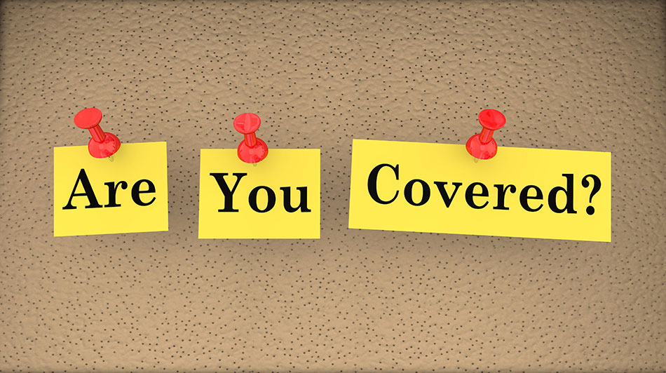 Corkboard that says “Are You Covered” in sticky notes.