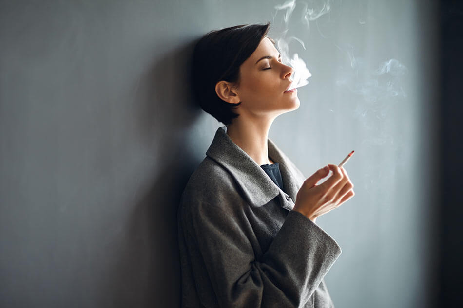 Woman wearing contact lenses and smoking